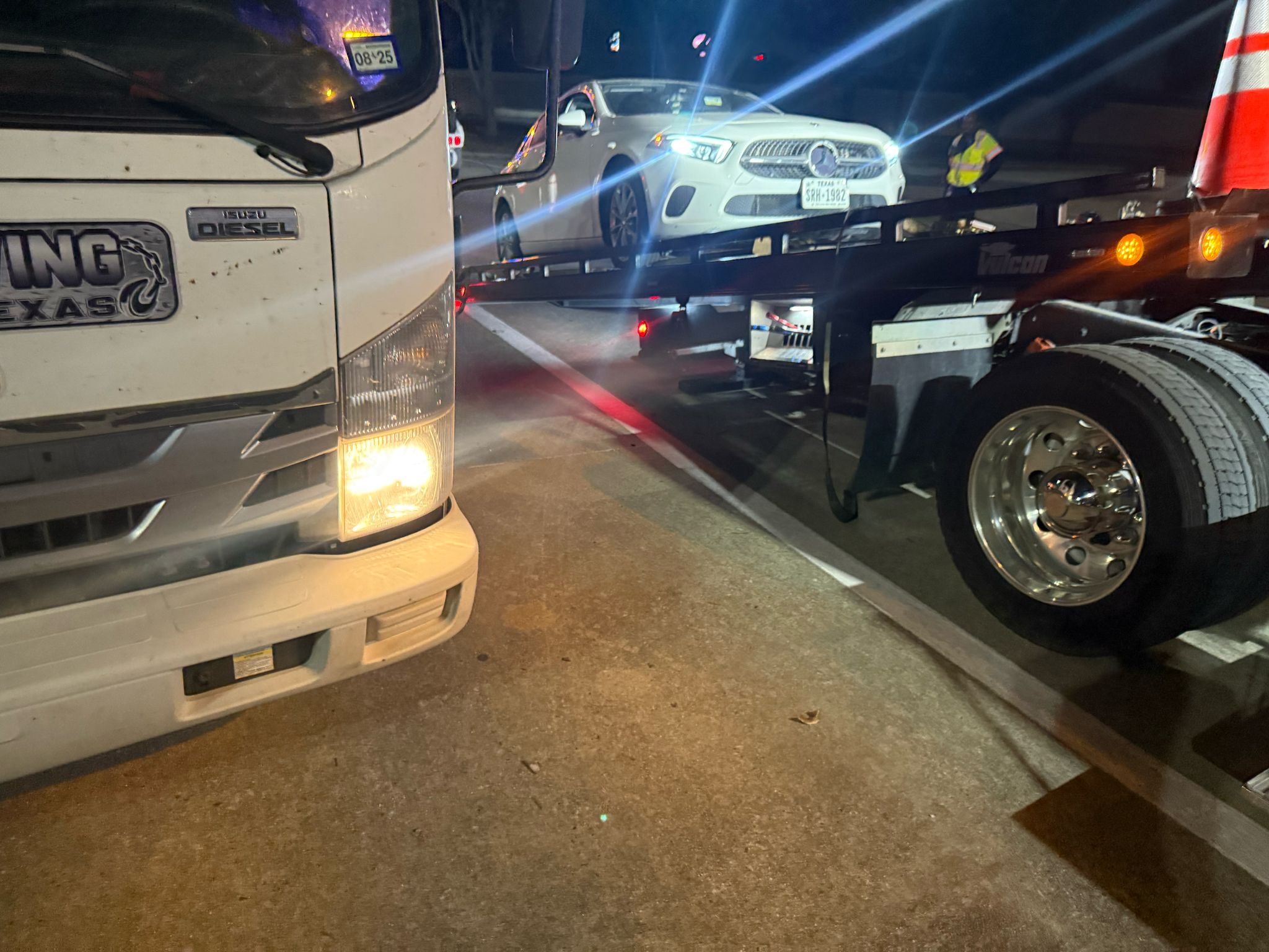 GTI Towing — car being towed on flatbed
